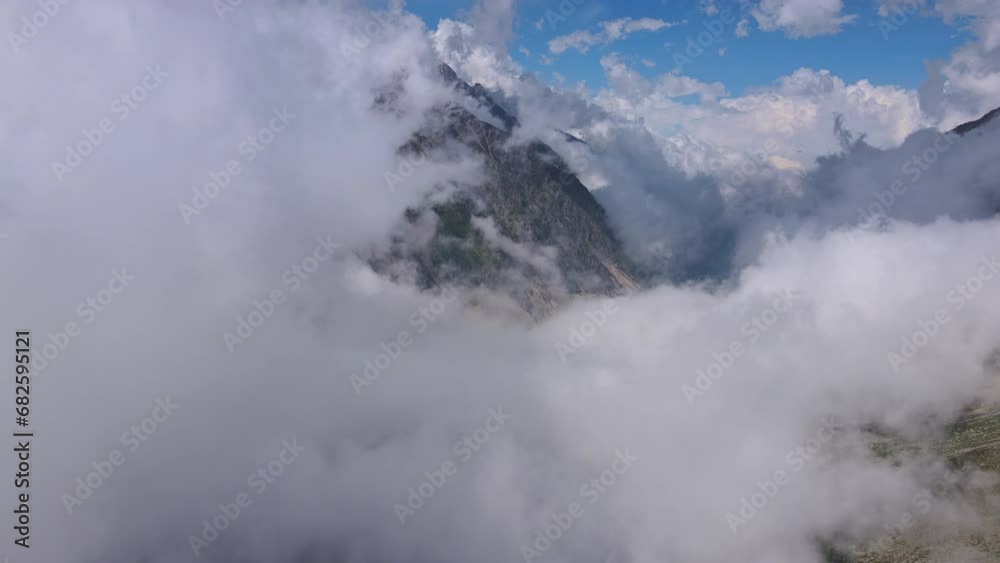 Stunning mountain alpine gorge with swirling clouds Stunning mountain alpine gorge with swirling clouds