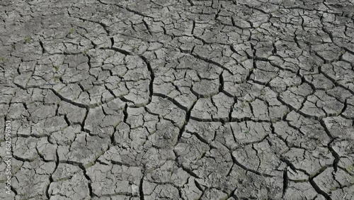 Cracked mud dried ground in lake bed. Global warming concept. Dry cracks in land, serious water shortages. Drought photo