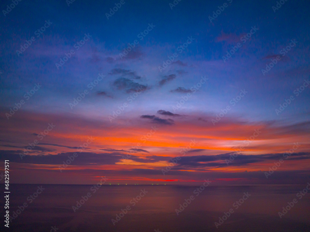 aerial view amazing sky at sunset..Scene of Colorful romantic sky sunset with cloud in the sky background..colorful clouds moving away rolling.