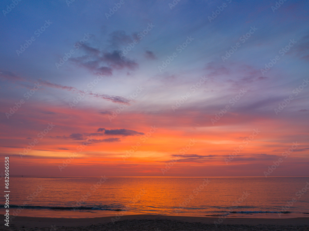 Aerial view amazing colorful sky in sunset above the ocean..beautiful landscape with sweet purple sky in sunset a panoramic view. .Dramatic Sky at sweet Sunset and purple hour
