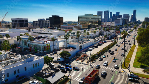 Aerial view over Santa Monica Boulevard in Beverly Hills with a view over the downtown high rise buildings - aerial photography