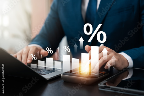 Interest rate and dividend concept, Investors are calculating profits and costs with calculators, return on stocks and mutual funds, long term investment for retirement, Long term business plan. photo