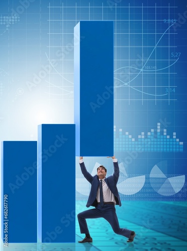 Businessman supporting growtn in economy on chart graph © Elnur