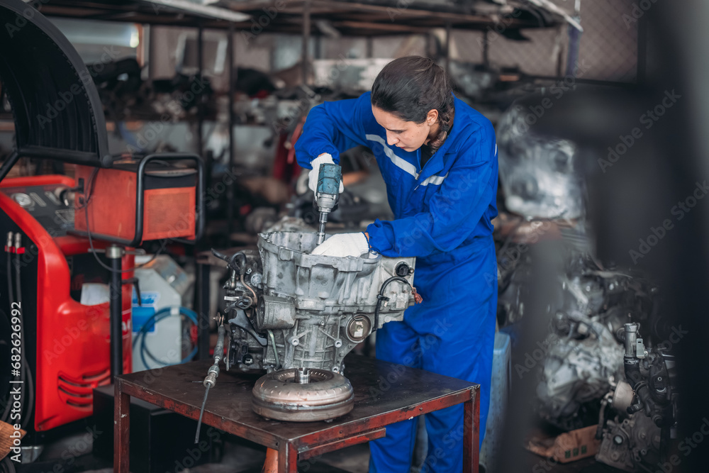 Car technician check engines, choose quality gear for precise repairs to ensure optimal performance Car technician check engines, choose quality gear for precise repairs to ensure optimal performance
