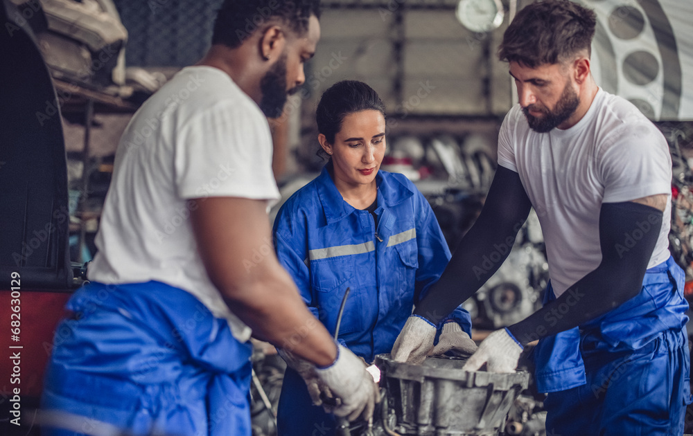 Fototapeta premium Car technician check engines, choose quality gear for precise repairs to ensure optimal performance