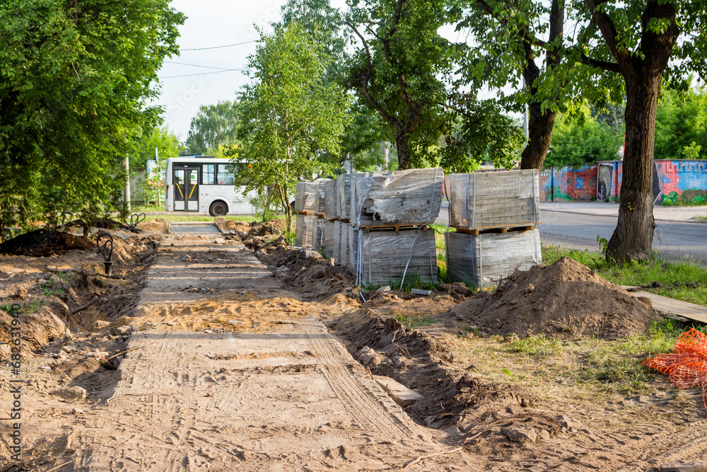 Naklejka premium Preparing a plot of land for laying paving slabs in a park