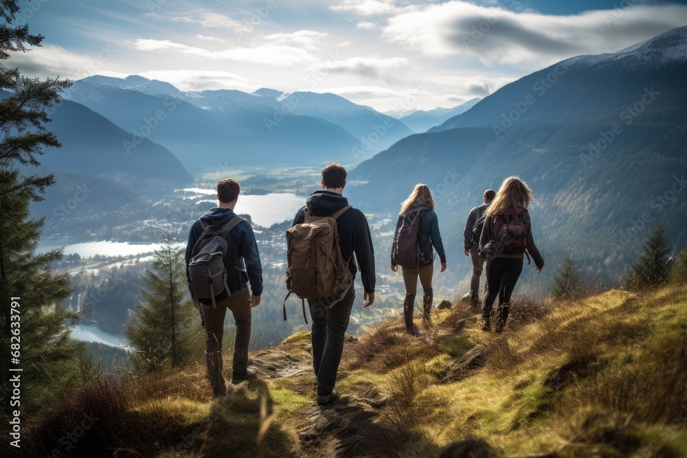 Group of hikers on a mountain top looking at the valley at sunset, a candid photo of a family and friends hiking together in the mountains in the vacation trip week, AI Generated