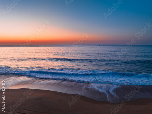 Fototapeta Naklejka Na Ścianę i Meble -  Soft sunrise seascape with hazy cloudless sky
