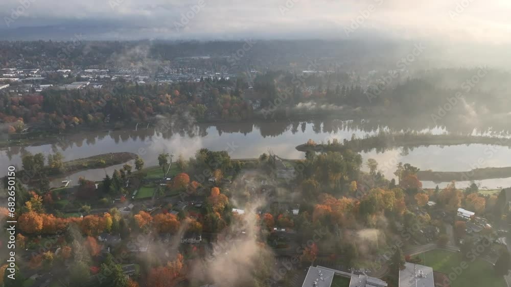 Early morning light illuminates the Willamette River south of Portland, Oregon. Autumn brings shorter days, cooler weather, and colorful forests to Oregon. 