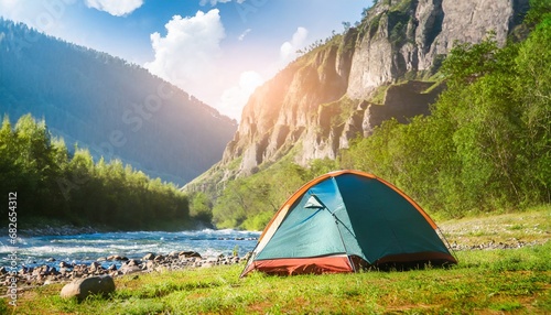 Amazing mountain landscape  Tent on the shore. small river meanders through green valley. sunny day perfect for hiking and exploring nature. travel and concept. ai generated. 