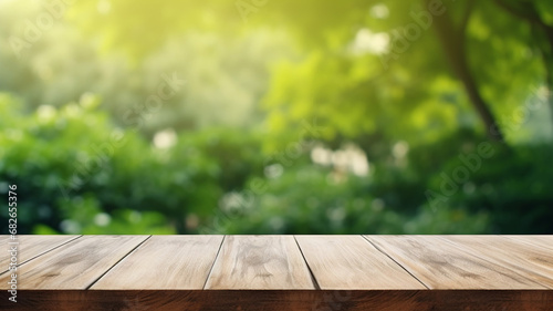 Empty wood table top and blurred green tree in the beautiful morning