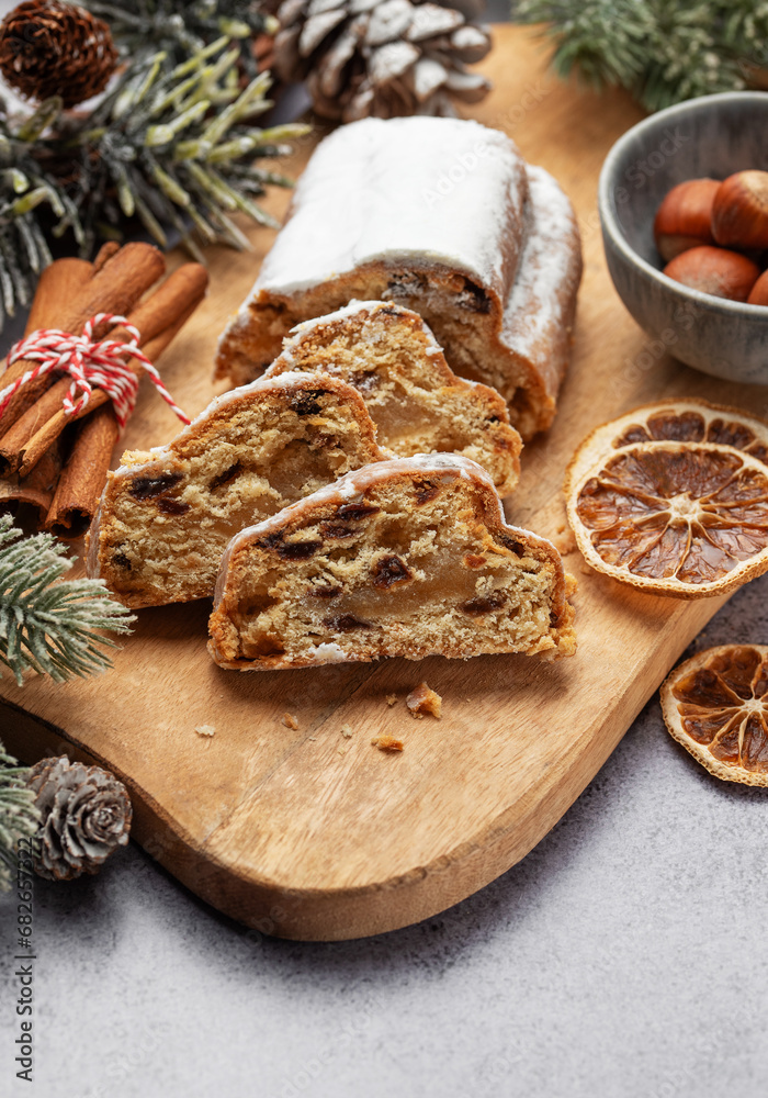 Fototapeta premium Christmas stollen with winter holidays decoration.