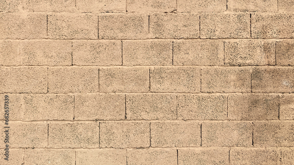 Fototapeta premium The wall is made of smooth light brown brick textured under the cork. Beautiful brickwork background.