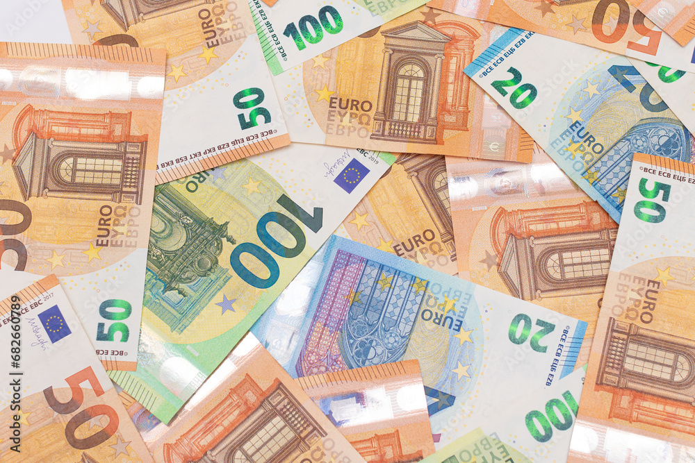 Different Euro Banknotes Money Background. Euro Money Currency. Colored Paper Money. A Lot of Fifty Euro Bills. Business, Finances, Cash and Money Saving Concept Different Euro Banknotes Money Background. Euro Money Currency. Colored Paper Money. A Lot of Fifty Euro Bills. Business, Finances, Cash and Money Saving Concept