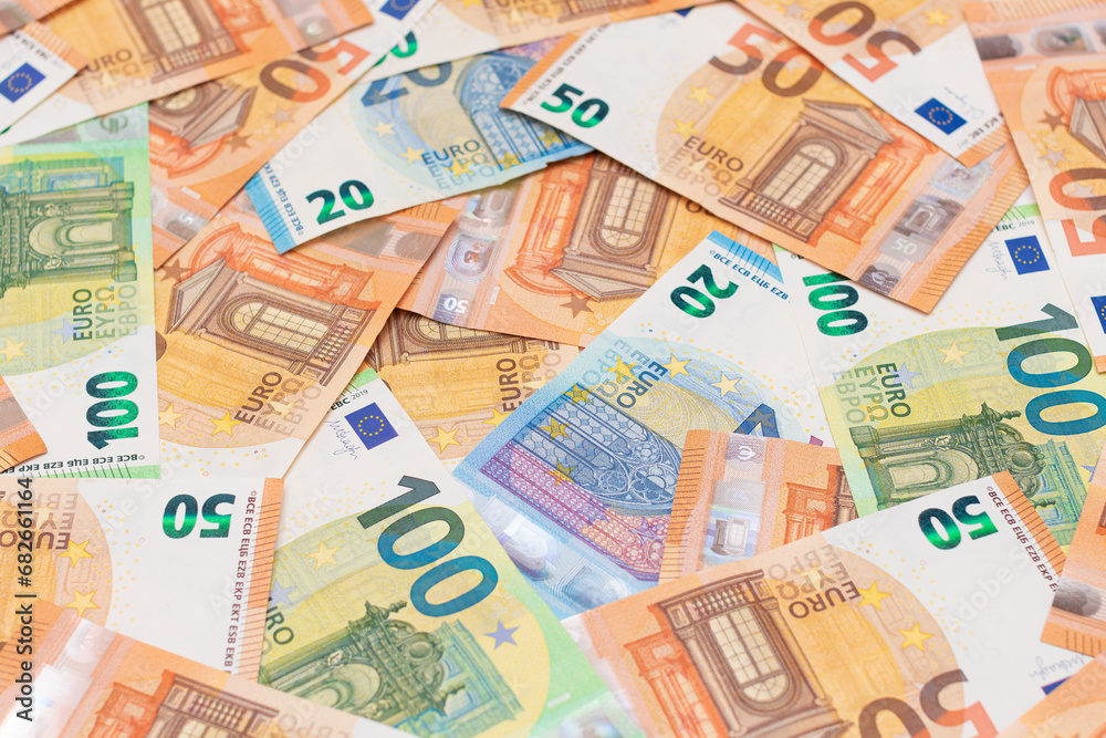 Different Euro Banknotes Money Background. Euro Money Currency. Colored Paper Money. A Lot of Fifty Euro Bills. Business, Finances, Cash and Money Saving Concept