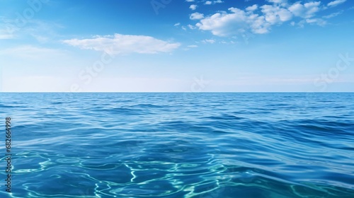 a body of water with blue sky and clouds