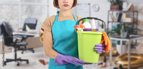 Female cleaner with supplie...