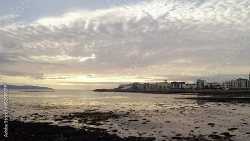 Epic sunset above Salthill and Grattan Beach in Galway bay ireland at low tide photo