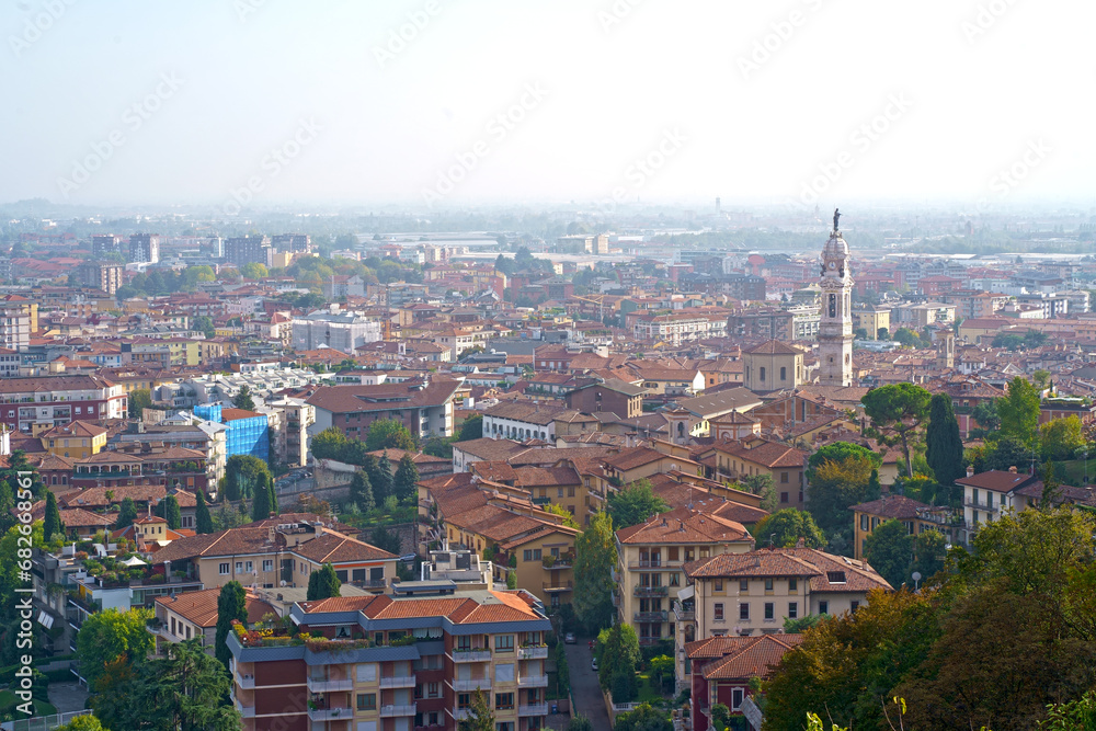 Fototapeta premium Bergamo. One of the beautiful city in Italy. Landscape at the old town from San Vigilio hill. Amazing view of the towers, bell towers and main churches. Touristic destination. Best of Italy