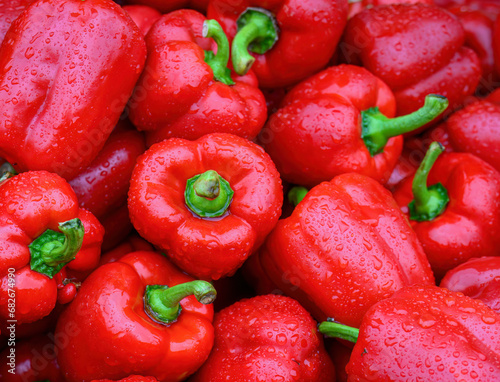 Papier peint Red capsicums with raindrops in the market for sale