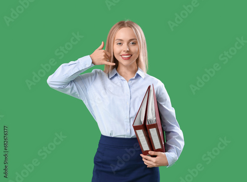 Female secretary with folde...