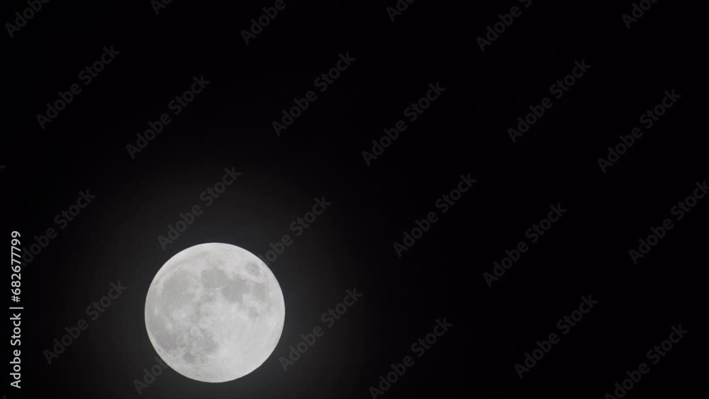 Motion Of Full Moon Rising In The Dark Sky At Night. - timelapse Motion Of Full Moon Rising In The Dark Sky At Night. - timelapse