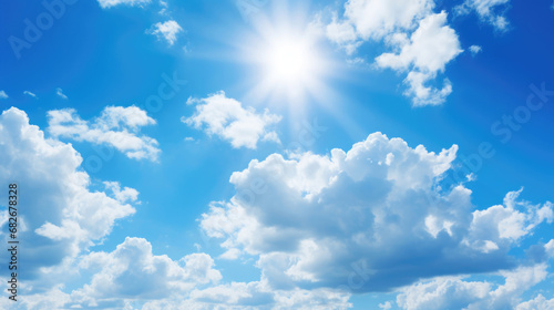 Background of blue sky and white clouds with the sun