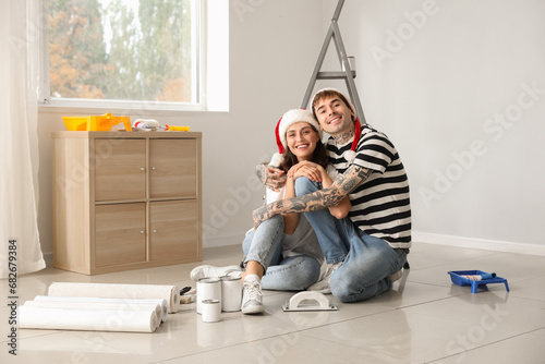 Young couple with Santa hat...