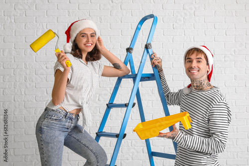 Young couple with Santa hat...