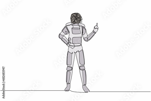 Single continuous line drawing astronaut with round scribbles instead of head, standing showing threatening gesture with clenched fist. Cosmonaut deep space. One line draw design vector illustration