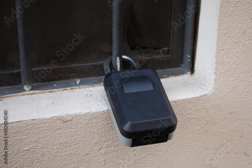 padlock Safe Key Box To Retrieve Keys in wall entrance door of tourism rent house photo