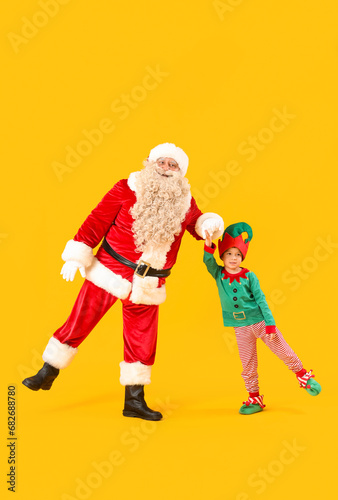 Santa claus and a little el...