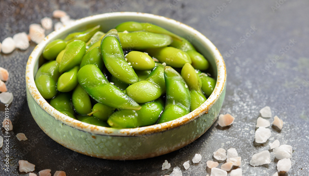 Cooked Green Organic Edamame with sea salt against a background Cooked Green Organic Edamame with sea salt against a background