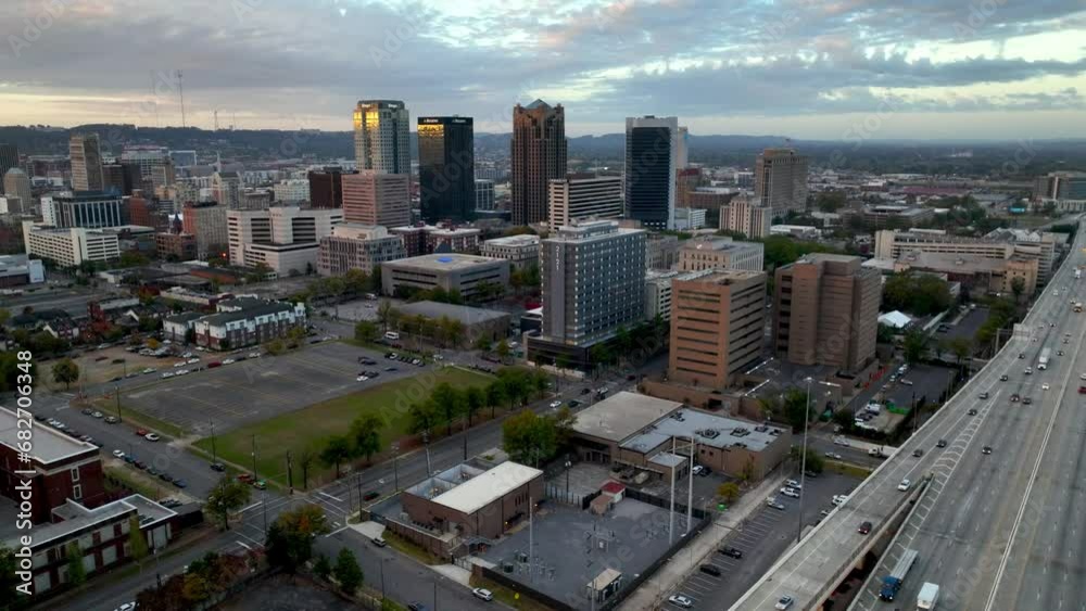 aerial pullout over freeway and rush hour birmingham alabama skyline captured in 5k