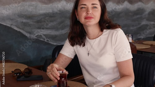 Beautiful brunette Woman face close up with expression of agree, waving yes gesture on camera, listening to her partner and negotiating