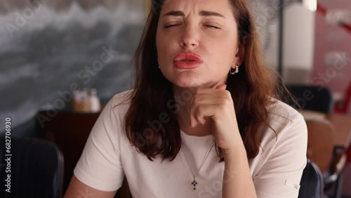 Beautiful brunette Woman face close up with expression saying yes of course, woman agrees totally emotional