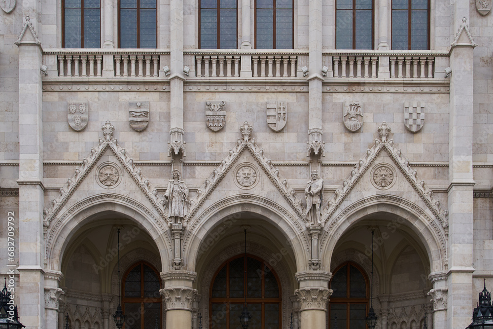 Bas relief on a facade of the Hungarian Parliament Building (Hungarian: Országház). Budapest, Hungary - 7 May, 2019