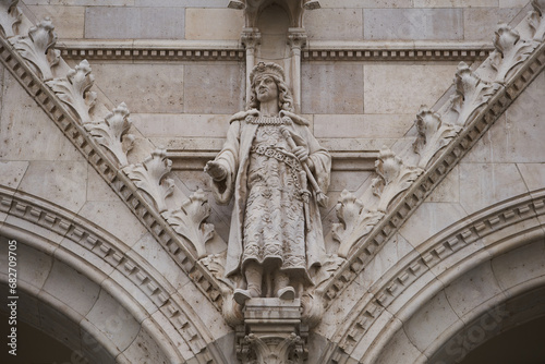 Statue of Matthias Corvinus  Hungarian  M  ty  s Hunyadi   King of Hungary and Croatia on the entrance of the Hungarian Parliament Building  Hungarian  Orsz  gh  z . Budapest - 7 May  2019