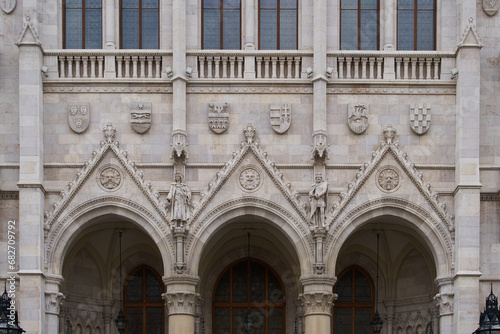 Bas relief on a facade of the Hungarian Parliament Building (Hungarian: Országház). Budapest, Hungary - 7 May, 2019