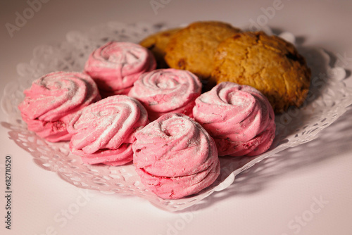 Home-made pink marsh-mallow, zephyr and cookies. Sweets closeup. Marshmallow, Meringue, Zephyr. Valentine's or Mothers Day concept