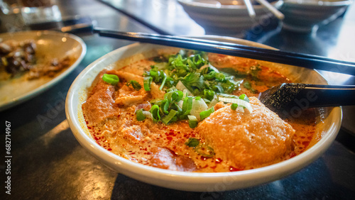 Photography Hot and spicy curry noodle on the table