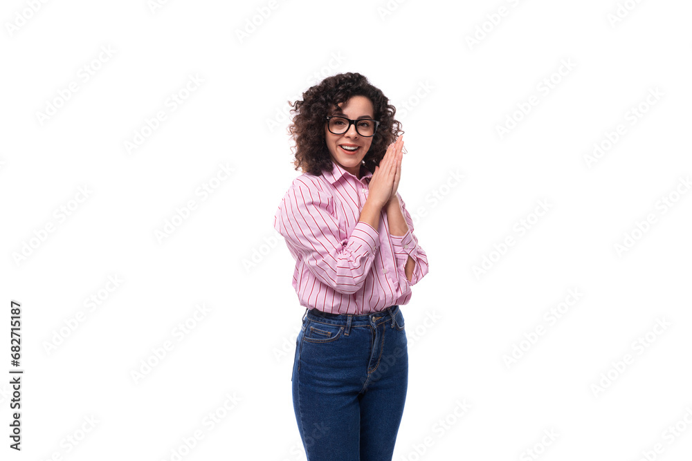 young beautiful curly brunette woman in pink shirt posing against background with copy space young beautiful curly brunette woman in pink shirt posing against background with copy space