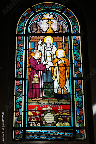 Saint Honore d'Eylau church, Paris, France. Stained glass. St Yves, St J.B. Vianney and St Peter Fourier photo