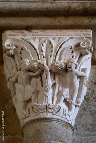 Saint Mary Magdalene basilica, Vezelay, France. Capital depicting men eating grapes photo