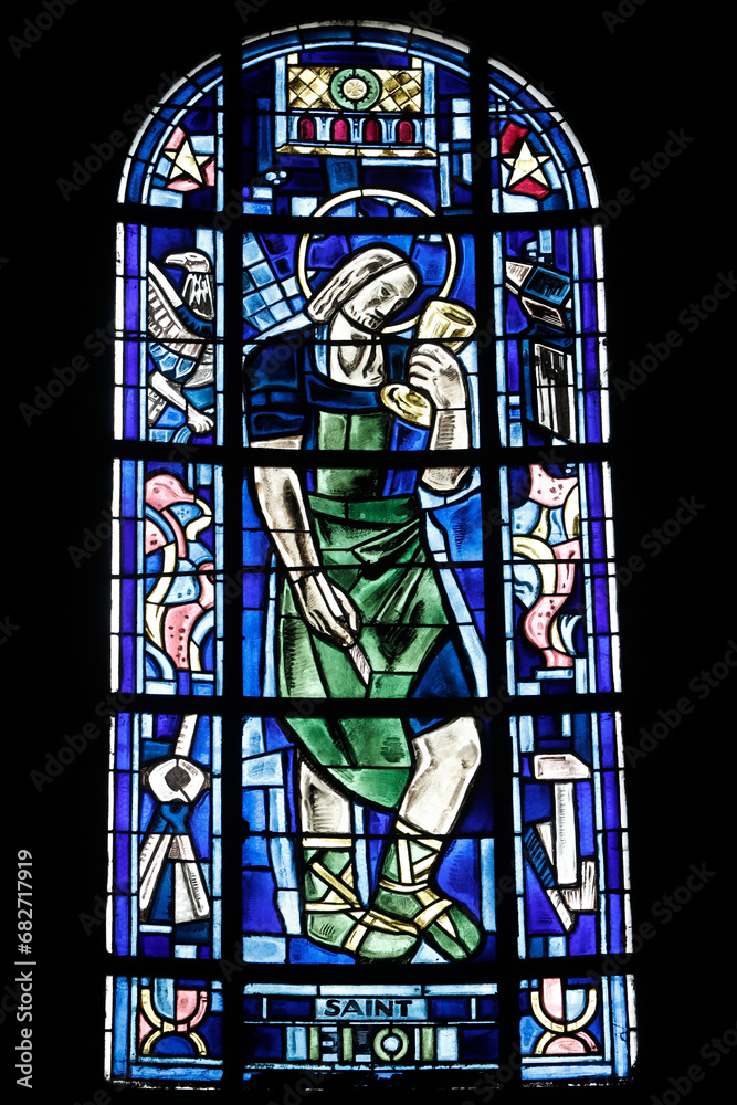 Stained glass in Notre Dame collegiate church, Poissy, France. St Eloi
