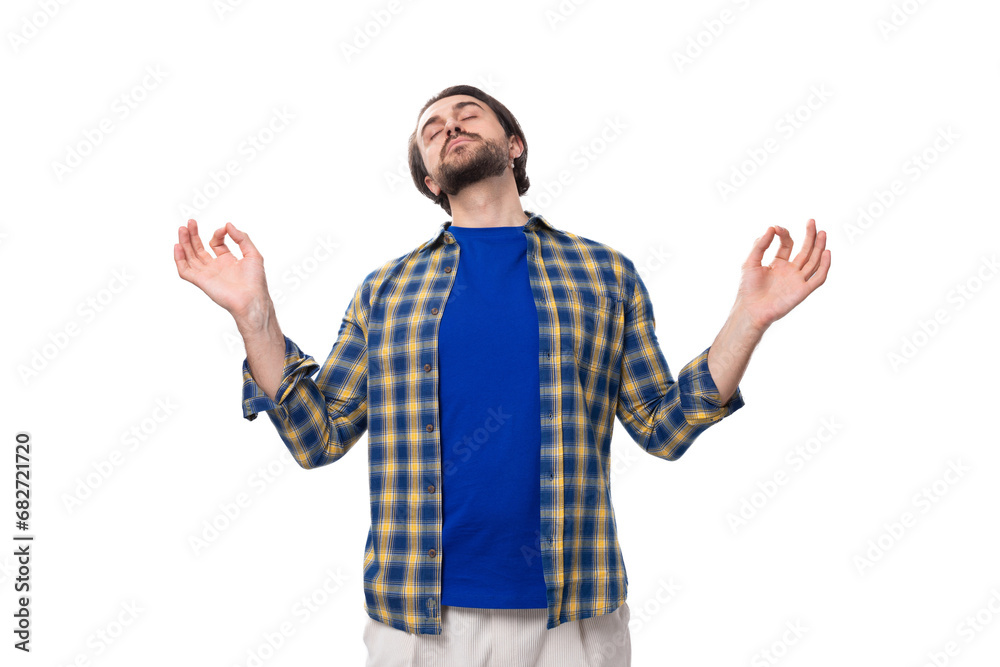 happy brunette brutal man with a beard in a plaid shirt rejoices in good luck happy brunette brutal man with a beard in a plaid shirt rejoices in good luck