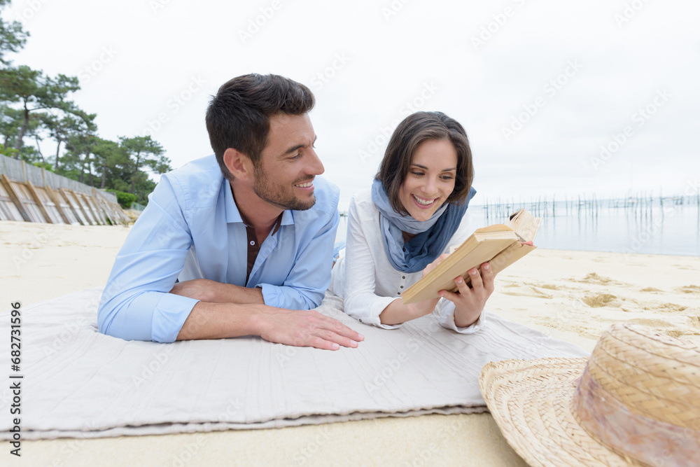 young couple dating on a beach