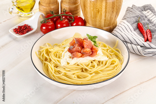 Pasta spaghetti with salmon and stracciatella
