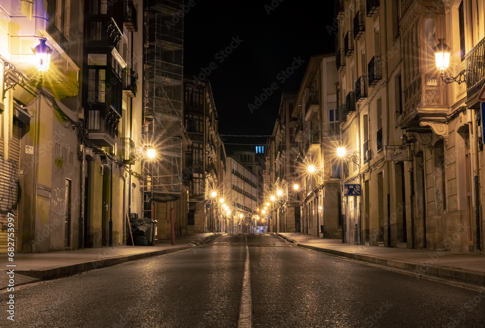 Central old town street at night in Logrono, north Spain. Small city urban lights in summer in an old street in the middle of the city