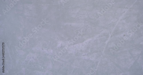 Blue ice in skate scratches, close up view photo